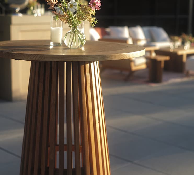 Side Table with two candles and a vase of flowers
